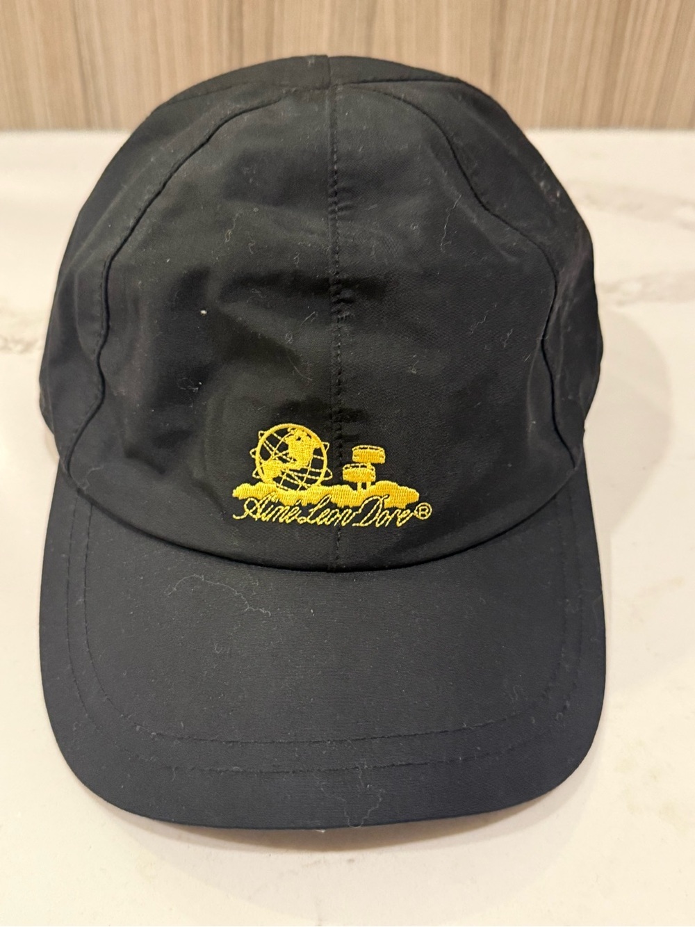 Aimé Leon Dore Unisphere Sports Hat – Black w/ Yellow Logo